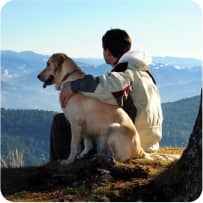 img - man-enjoying-mountain-view-with-his-dog