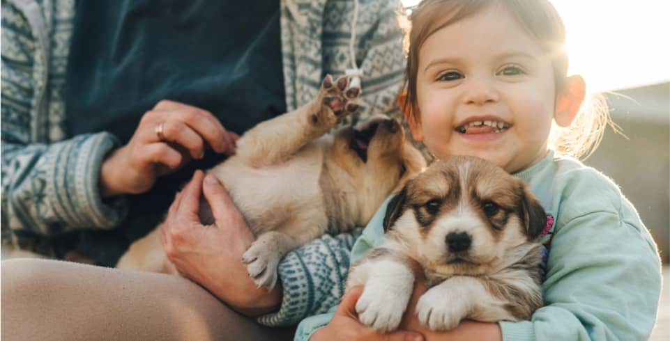 img - beautiful-woman-little-baby-girl-cuddling-small-puppy-family-pet